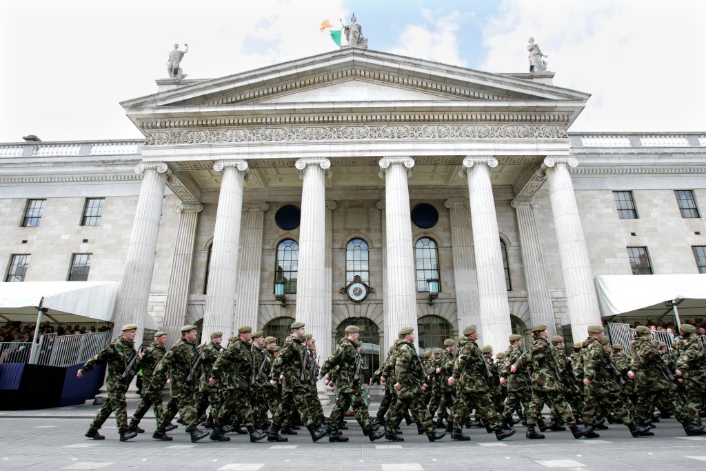 Reservists march by the General Post Office exterior to commemorate 1916