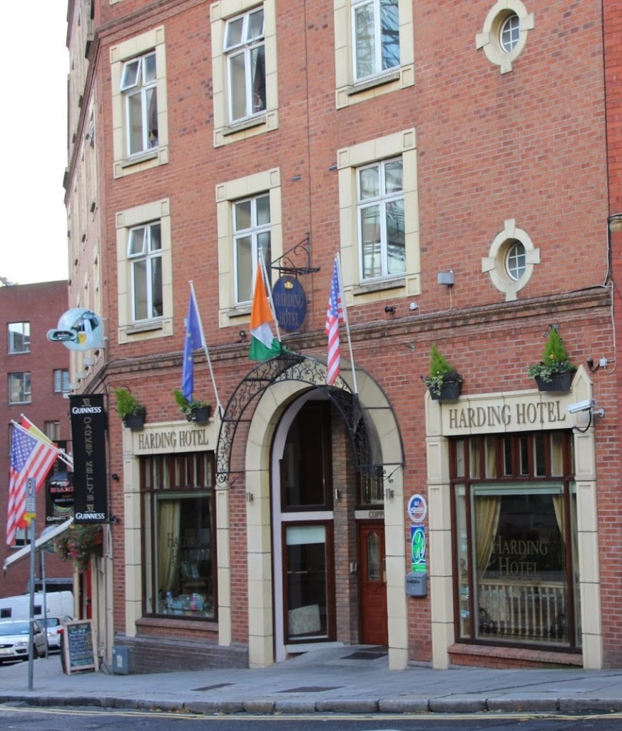 The Harding Hotel's flag bearing exterior and entrance