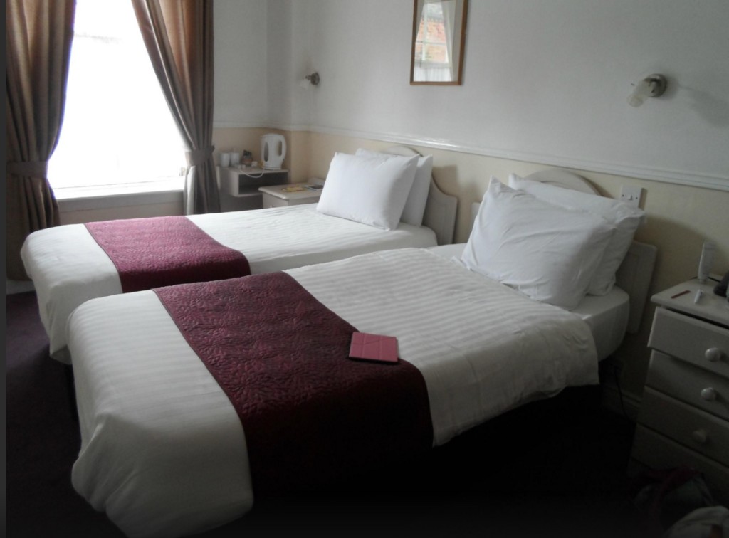 A spotless twin room in the River House hotel