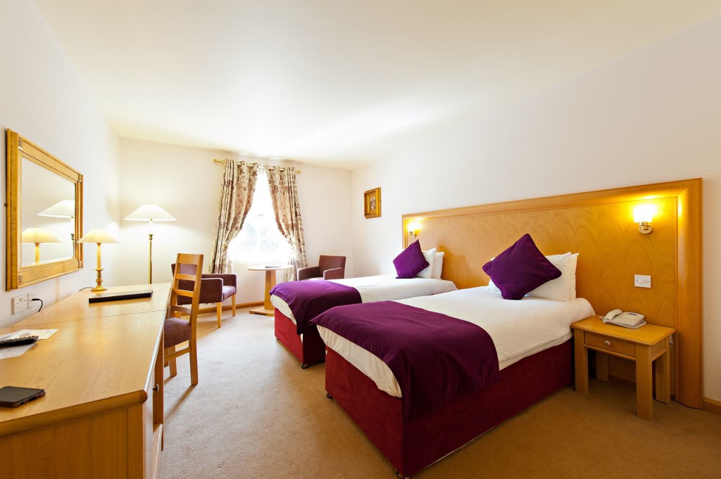 A twin bedroom in Roganstown Hotel and Country Club