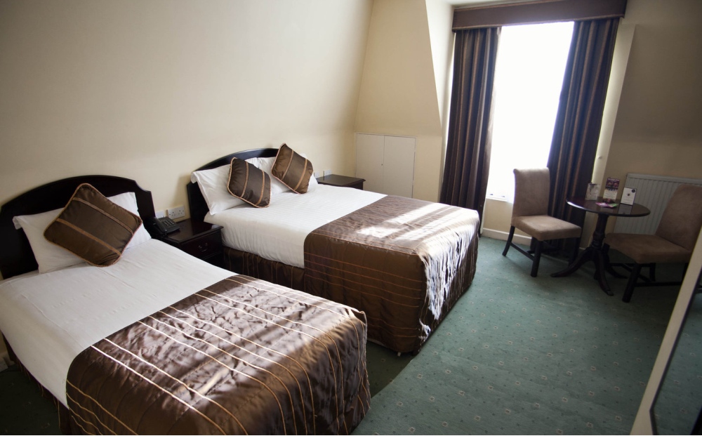 A spacious, well-lit twin bedroom at Parliament Hotel, Dublin