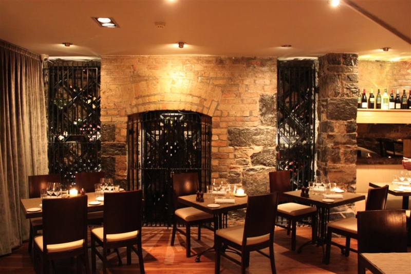 Warm and inviting interior with fireplace in Bloom Brasserie