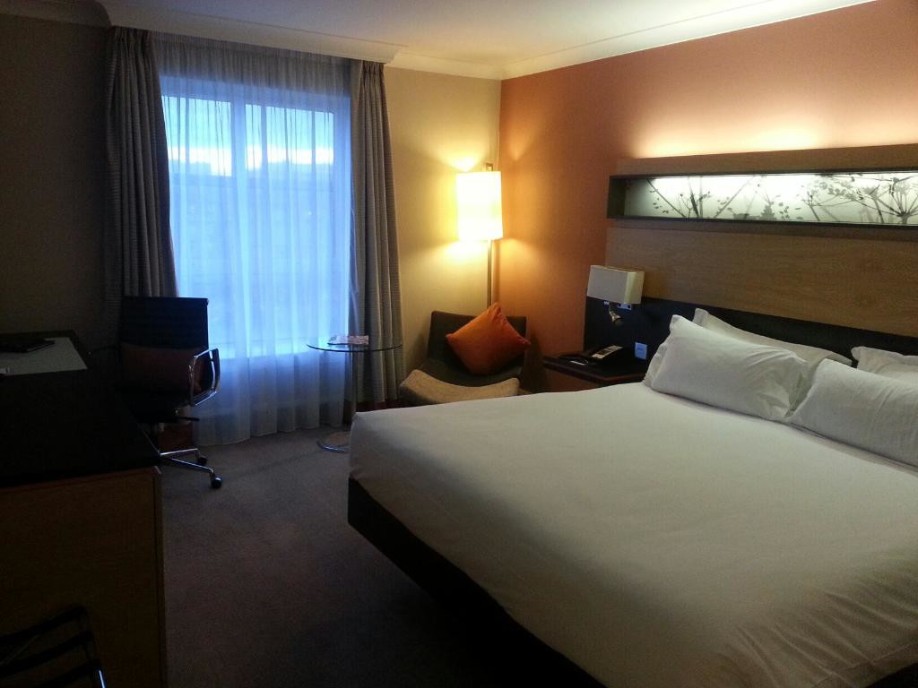 A spacious, well-lit double bedroom in Hilton Dublin
