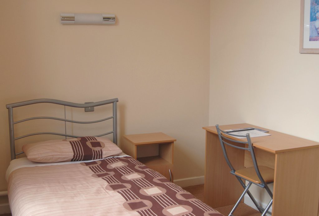 A basic but functional double bedroom in Marino Conference Centre
