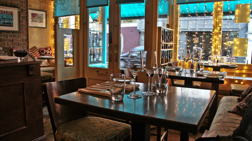 The classy, windowed dining area of Hugo's, Dublin