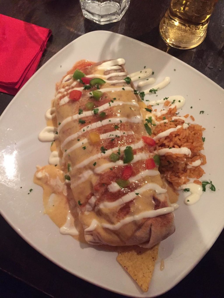 A cheese-topped burrito in Mexico to Rome restaurant