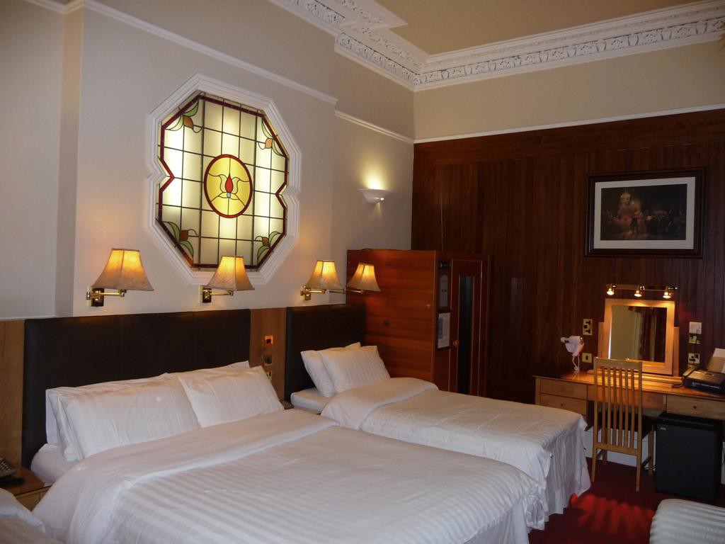 A spacious, comfortable family bedroom in Roxford Lodge Hotel