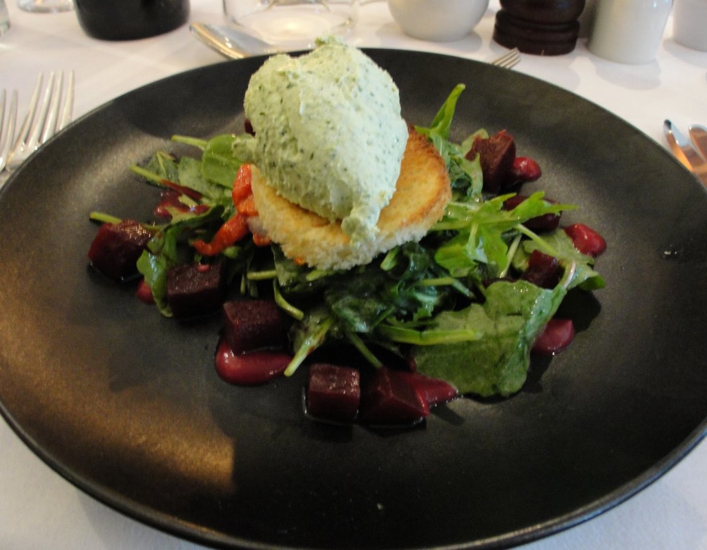 Salad with cream topping in Roly's Bistro