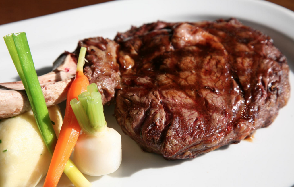 A succulently juicy steak with crisp vegetables in Darwins Restaurant, Dublin