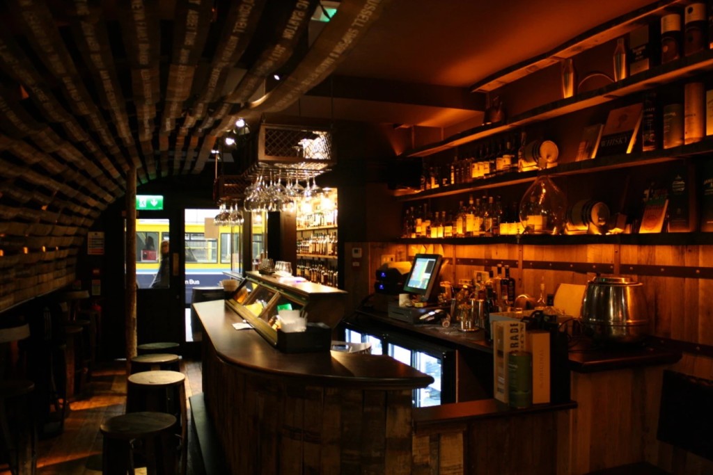 The dark, traditional interior of The Dingle Whiskey Bar